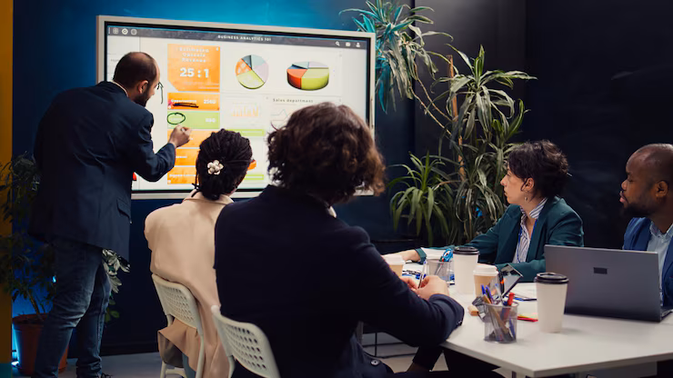 IT strategy consultant presenting a digital transformation roadmap to a business team in a modern office setting.