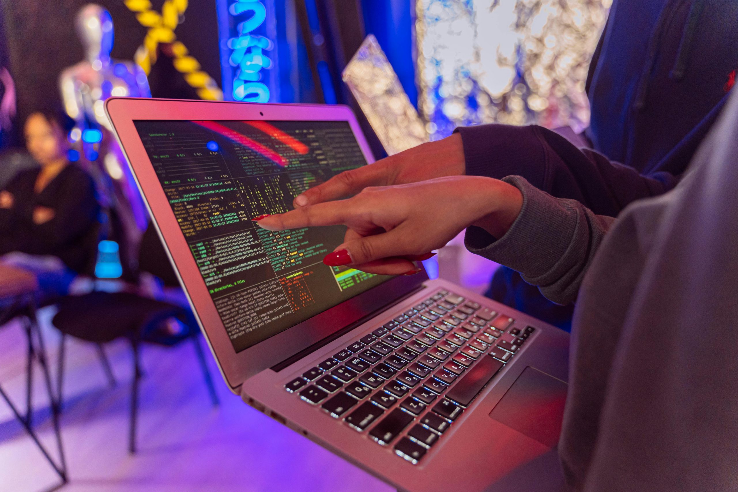 Software developer reviewing clean and well-structured code on a laptop.